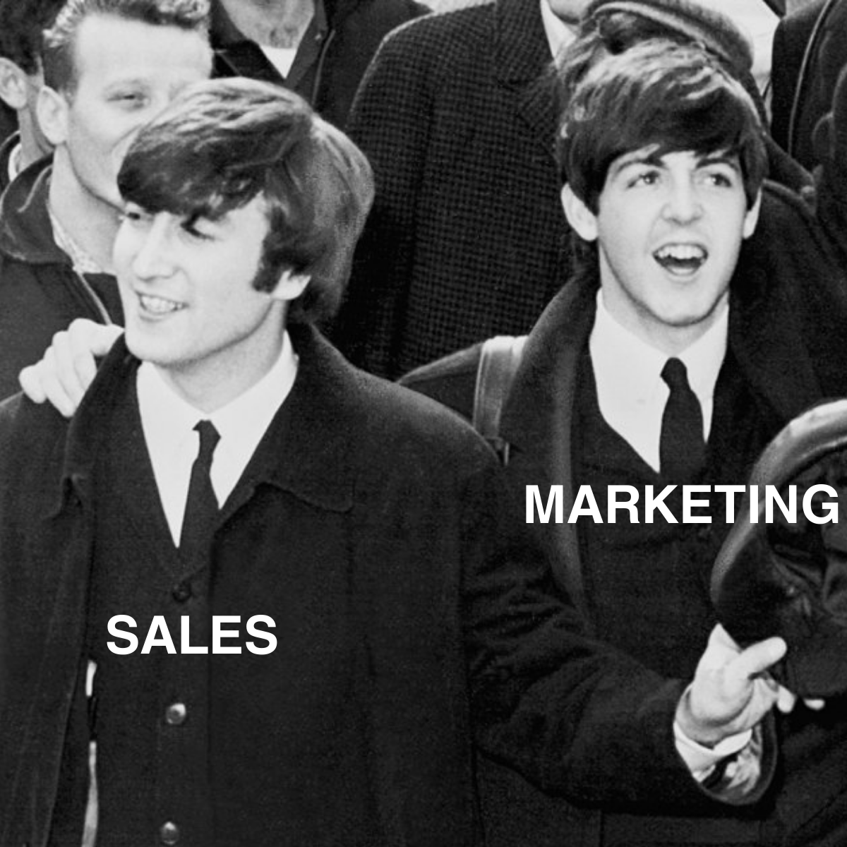 Lennon and McCartney from the Beatles with sales and marketing written over them. Sales and marketing synch