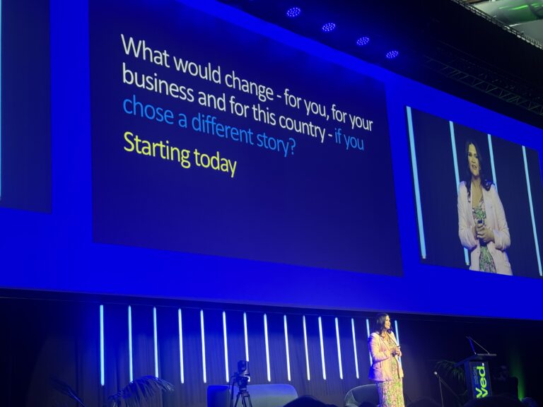 Nicola Taylor on stage at Revved., asking what would change if you chose a different story